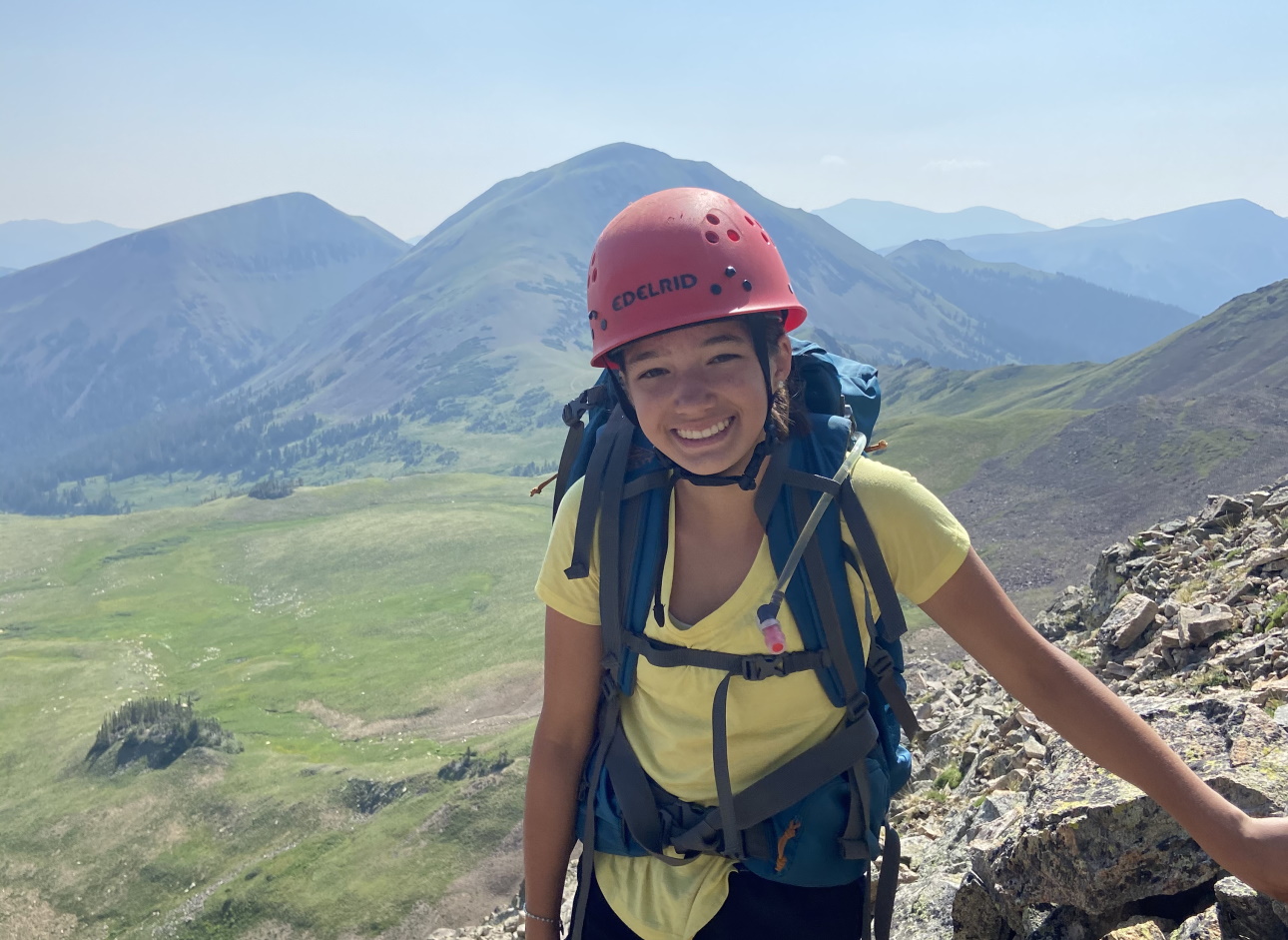 Girl with helmet smiling.