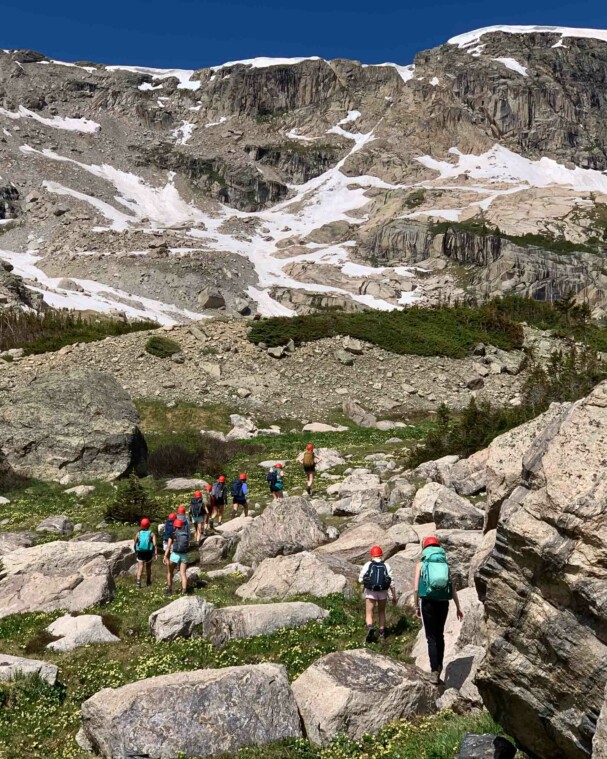 People hiking a mountain.