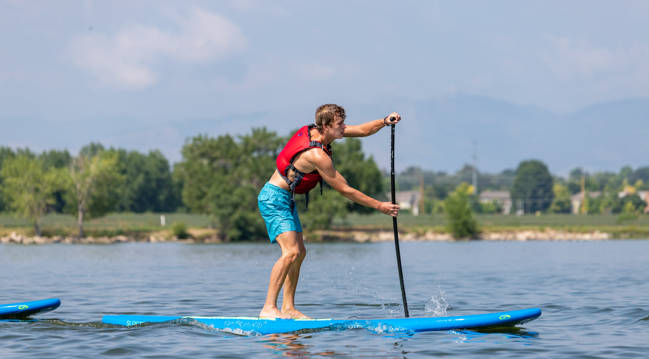 Boy on a paddle board.