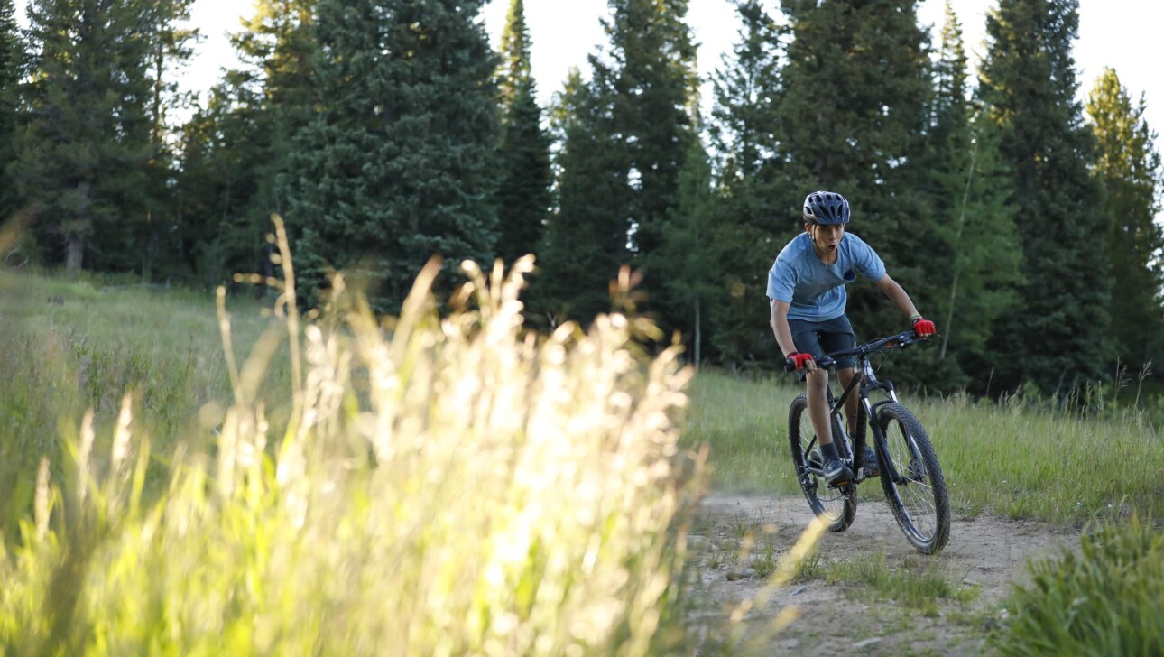 Boy riding a bike.