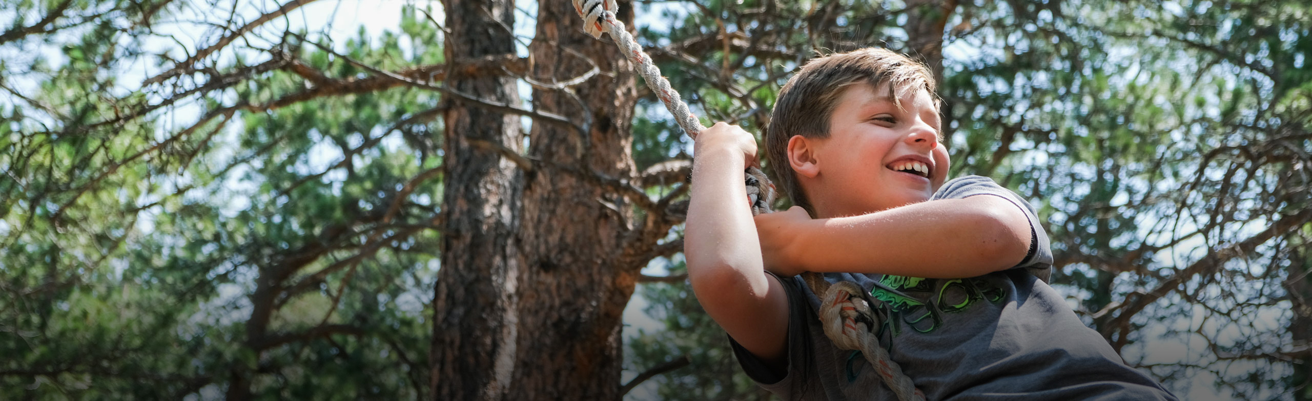 Boy on ropeswing.