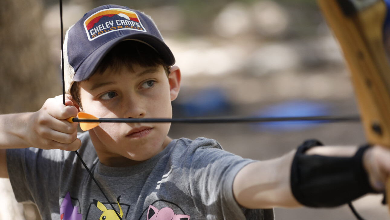 Boy with bow and arrow.
