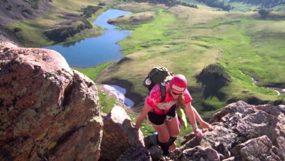 A camper rock climbing.