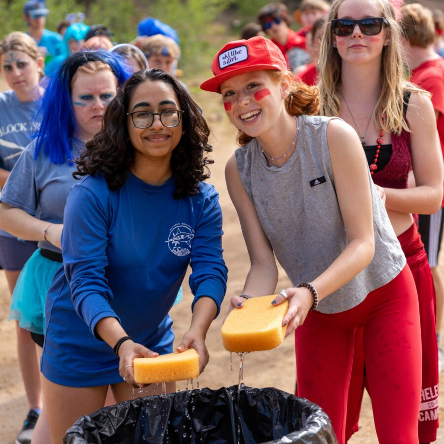 Girls smiling with sponges.