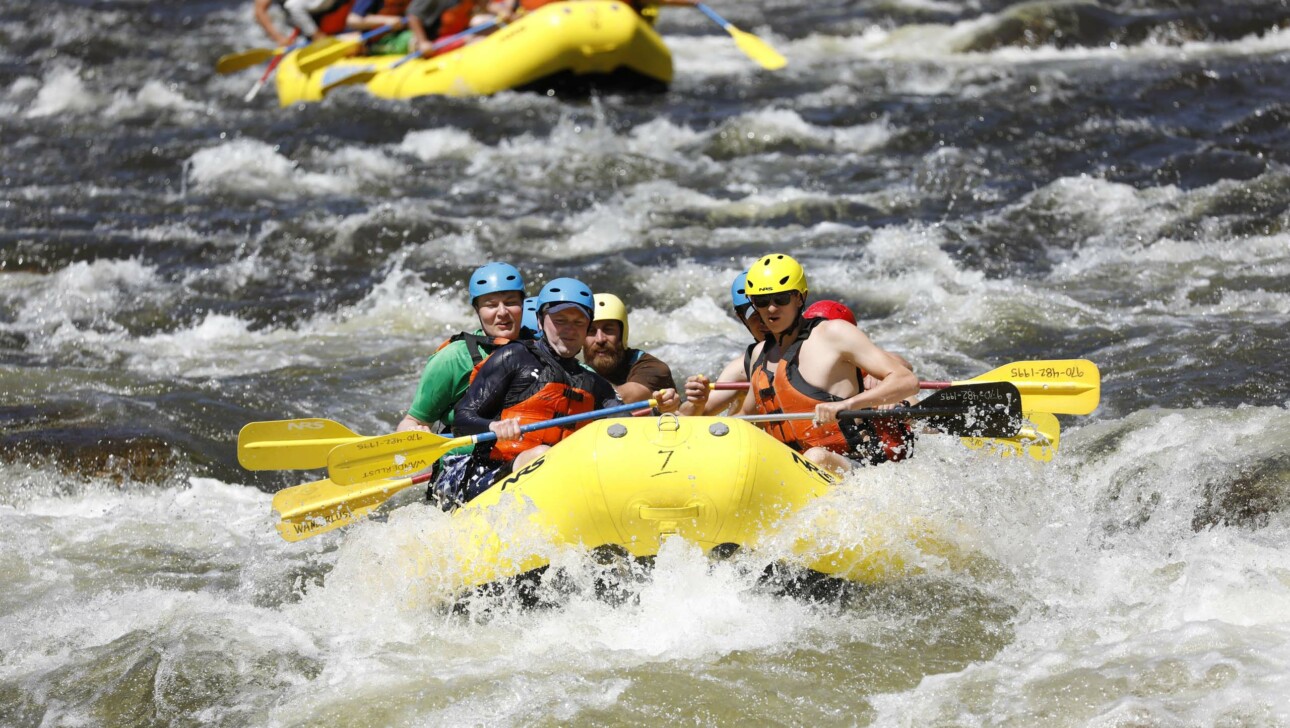 People on a raft on river.