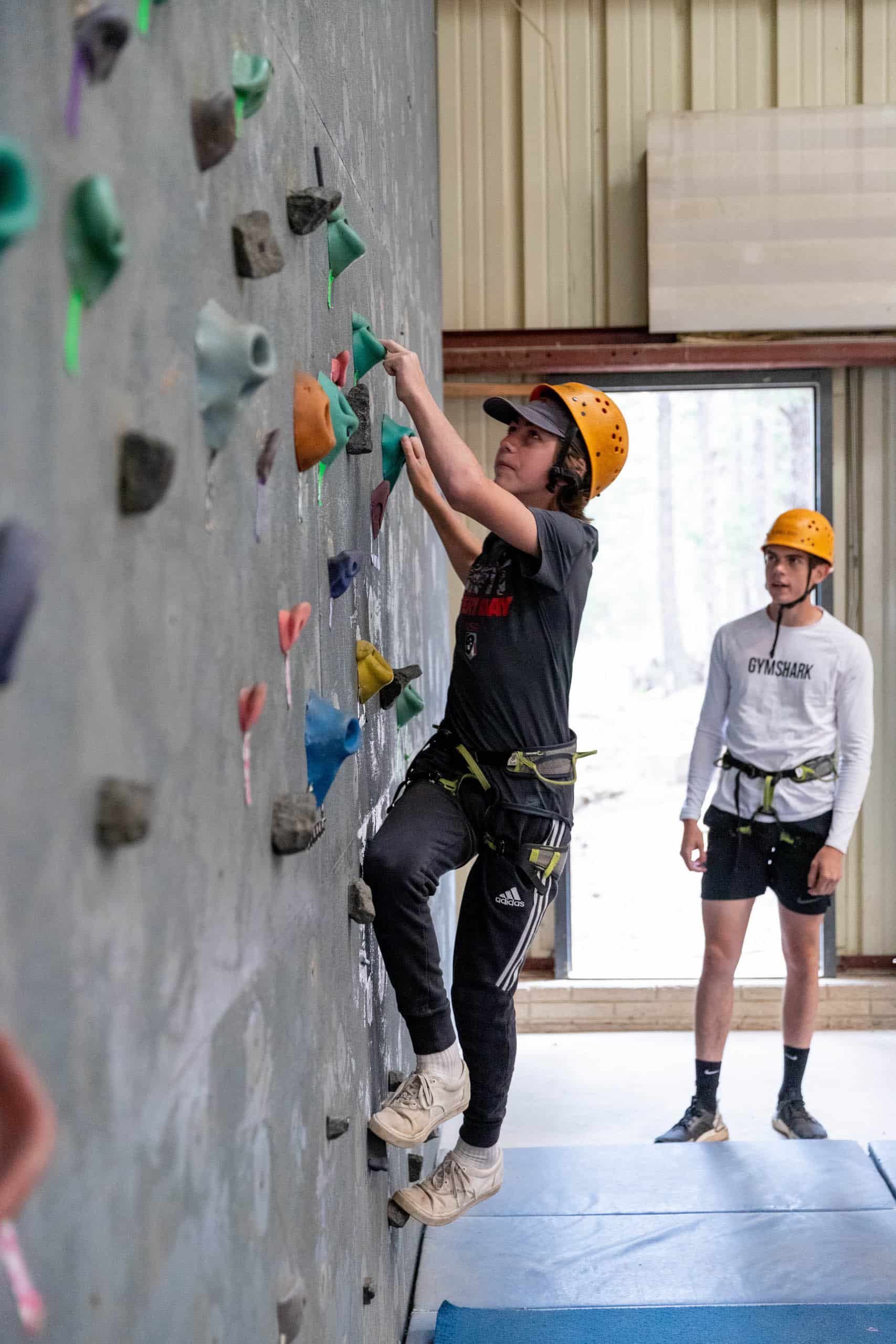 Camper starting on the rock wall.