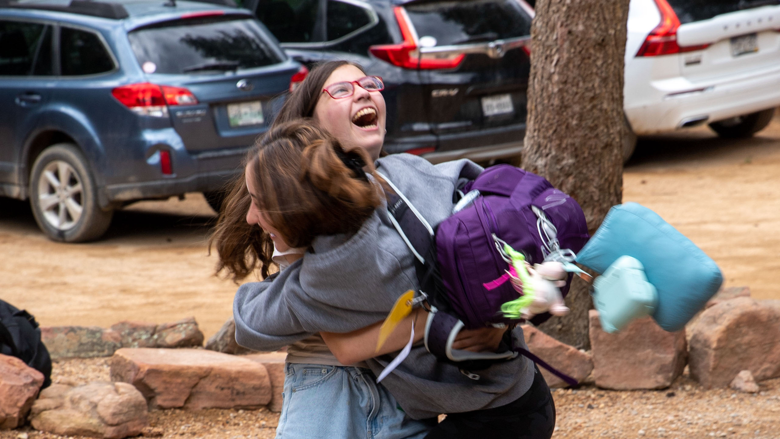 Two girls hugging.