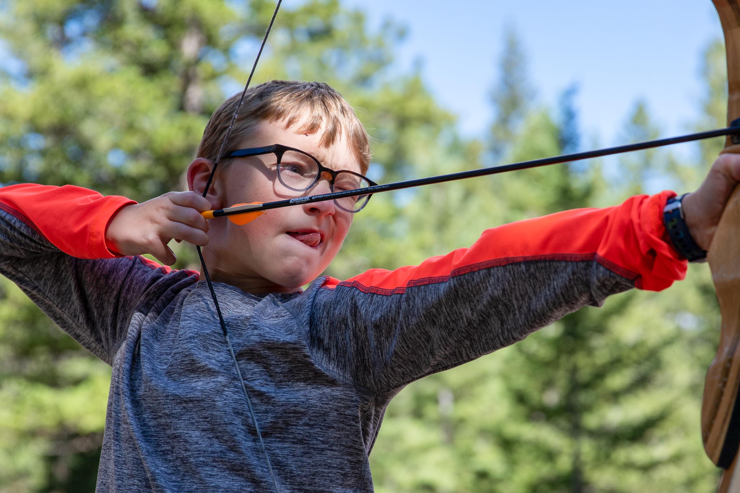 Boy with bow and arrow.
