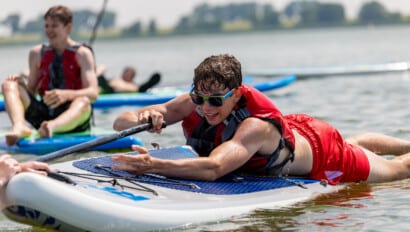 Boy on paddle board.