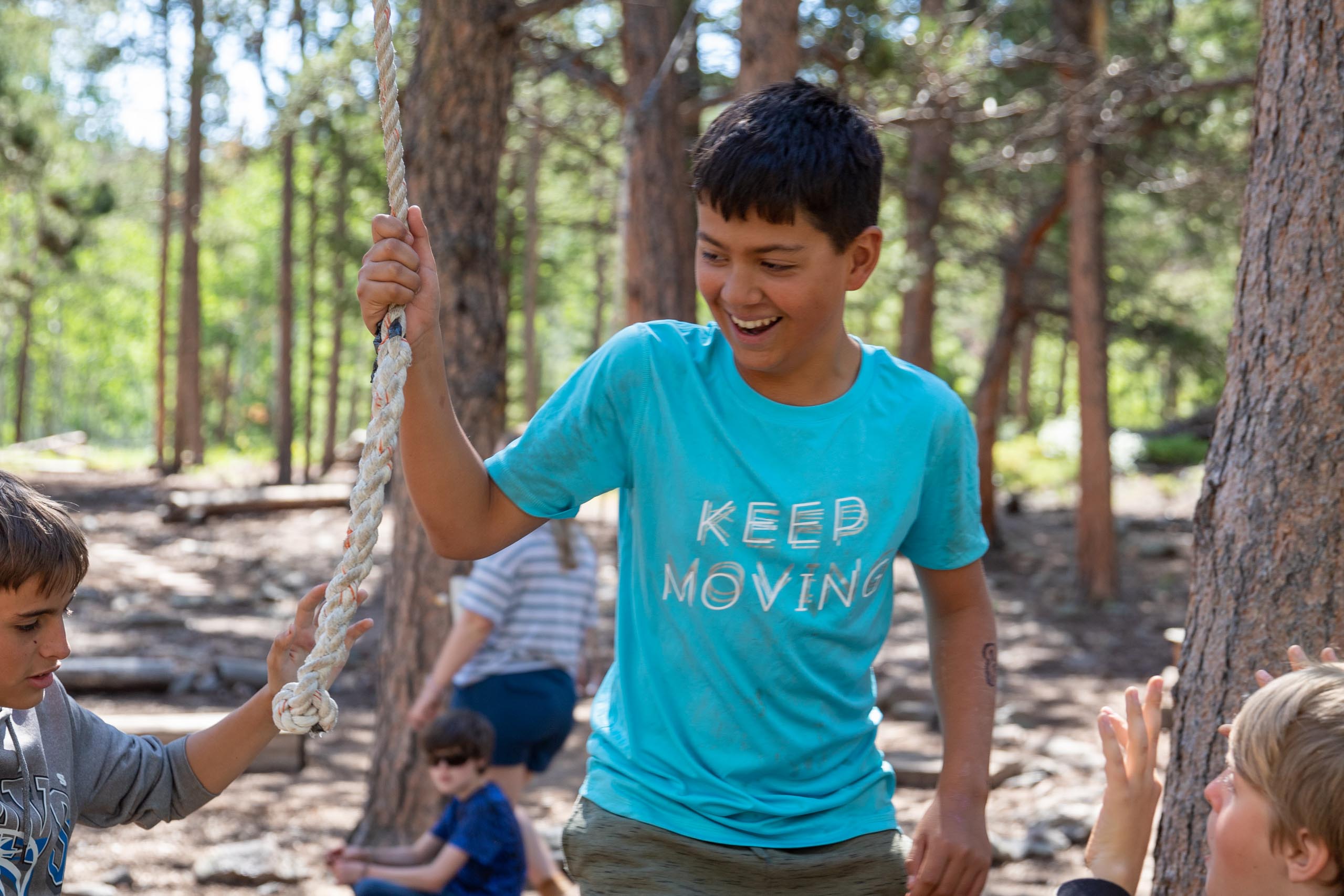 Boy holding rope.