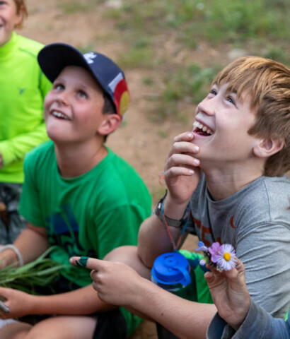 Boy smiling looking up.