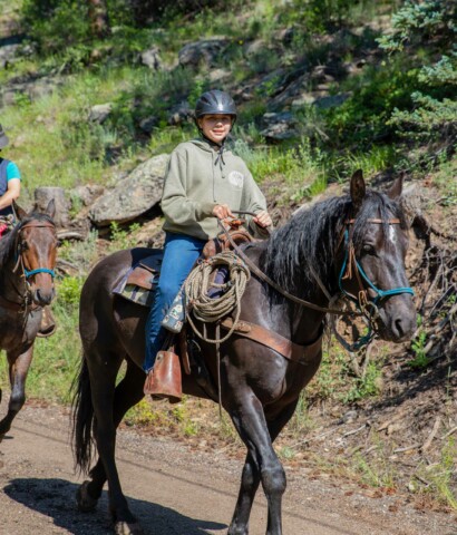 Girl riding a horse.