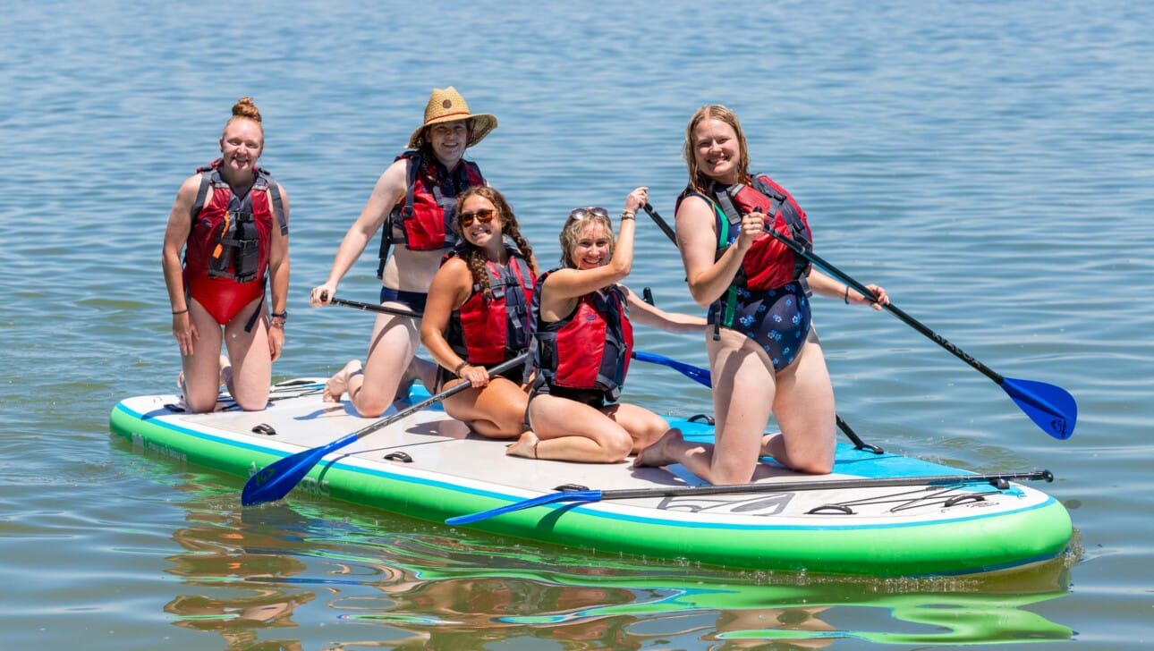 Girls on paddle board.