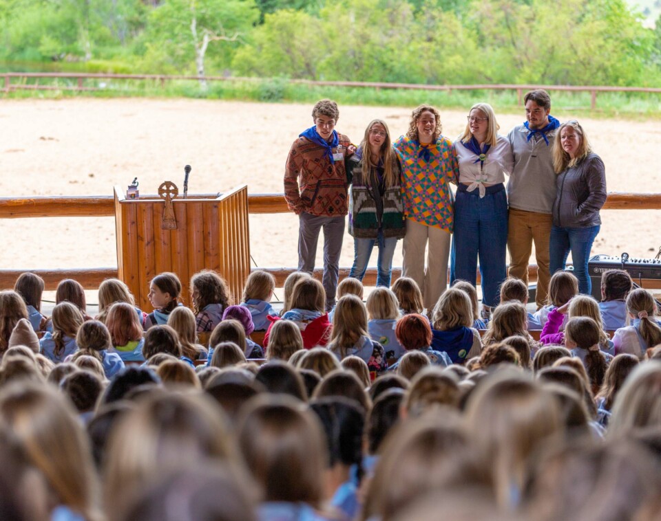 People on stage in front of crowd.