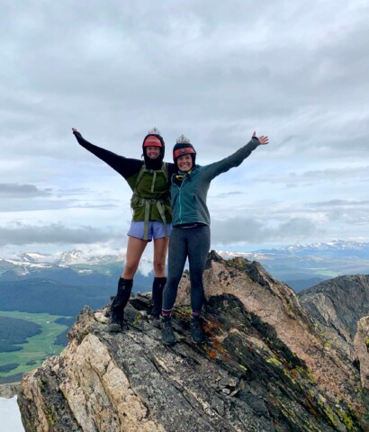 Two girls posing on rock.