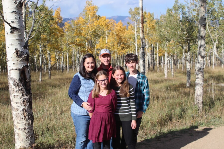 Portrait of betts family in front of yellow aspens