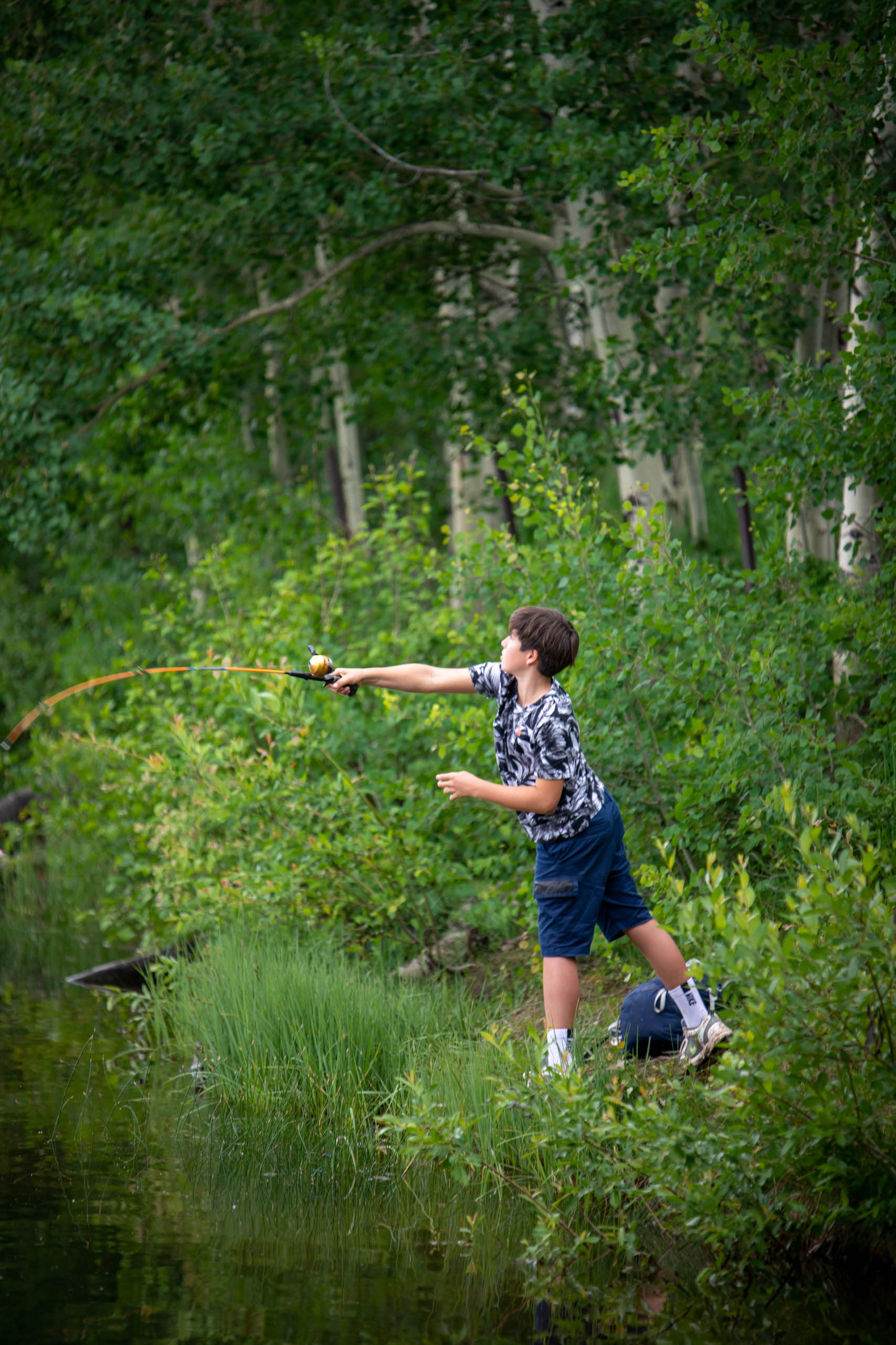 Camper casting a fishing line.