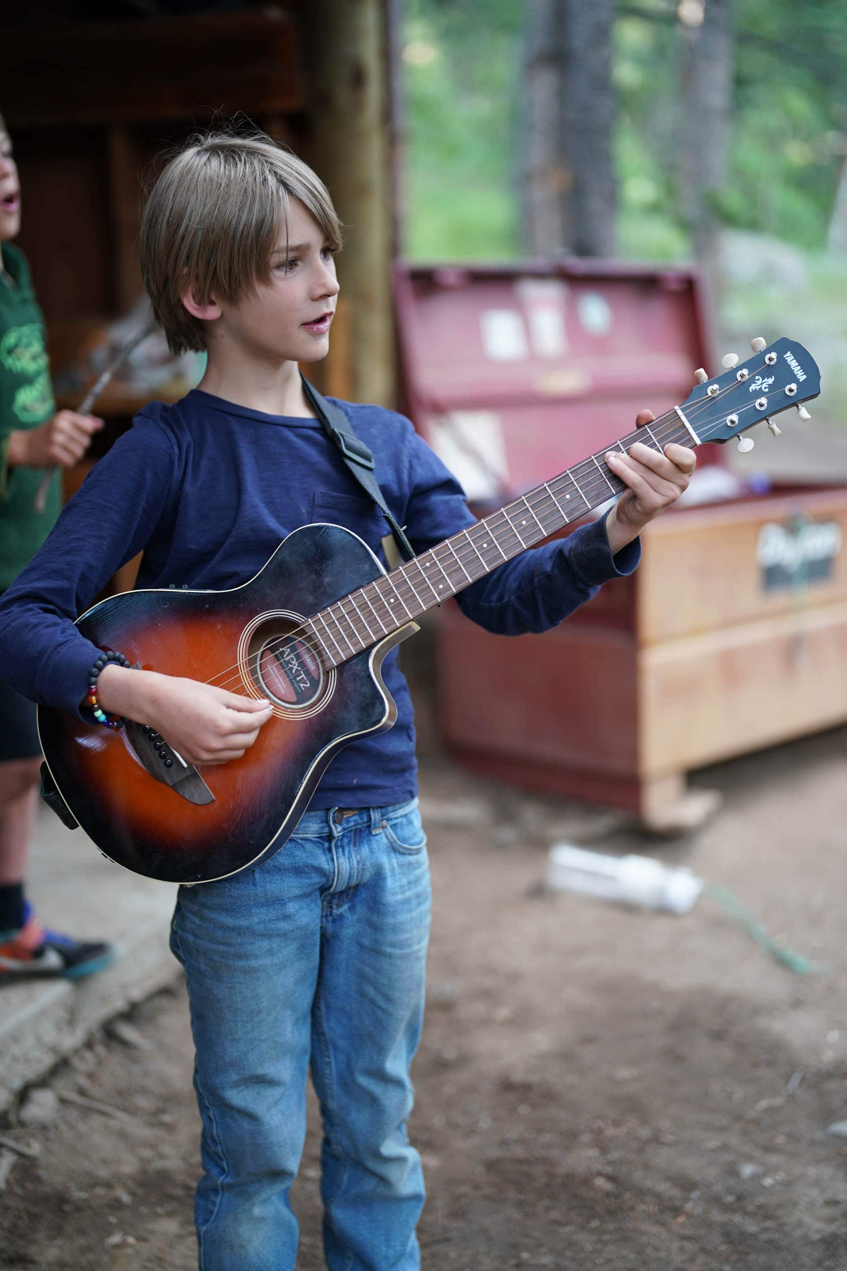 Camper playing the guitar.