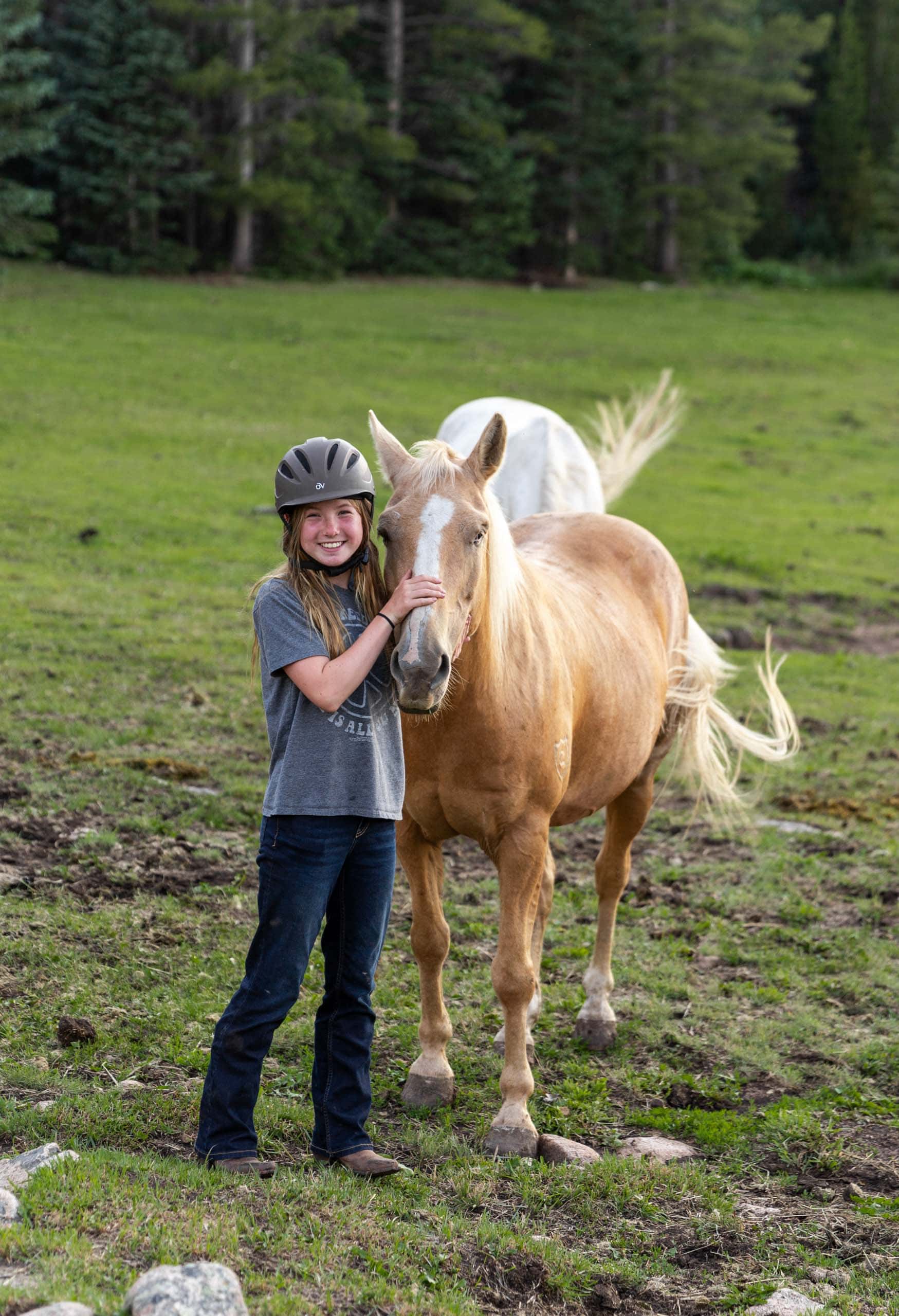Girl holding horse.