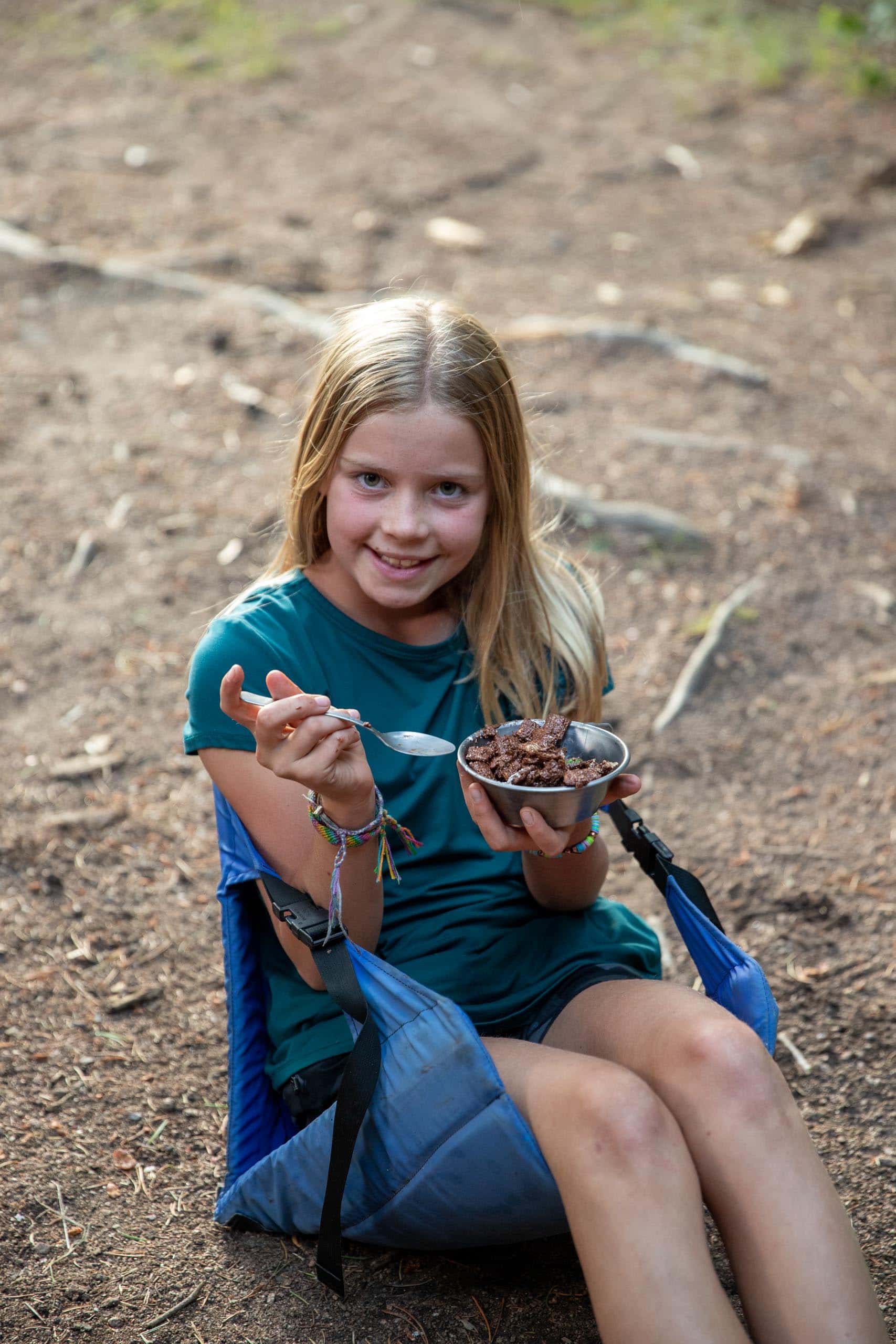 Girl sitting eating.